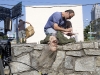 Special effect makeup artist Gino Crognale touches up a dummy zombie, "The Walking Dead" June 15, 2011